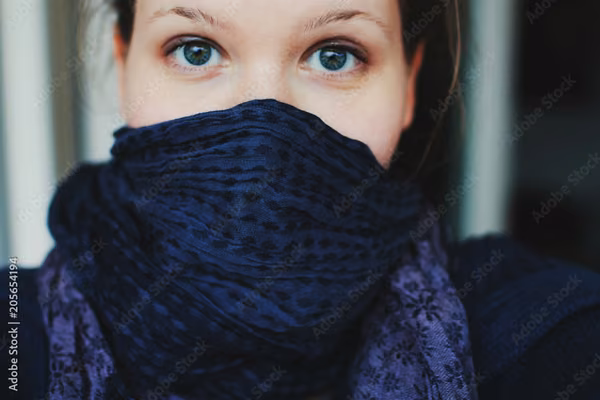 Woman with scarf over mouth for warmth - purchase in July